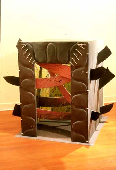 Image of large free standing slate box pierced by slate spears.