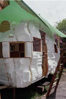 Process image of trailer with windows,the walls made of stryfoam blocks.