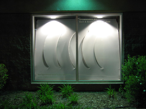 Image of an installation in a display window, 
featuring kinetic gill-like movement of fabric surface.