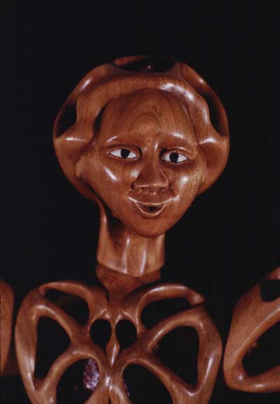 Image of perforated wooden doll's head.
